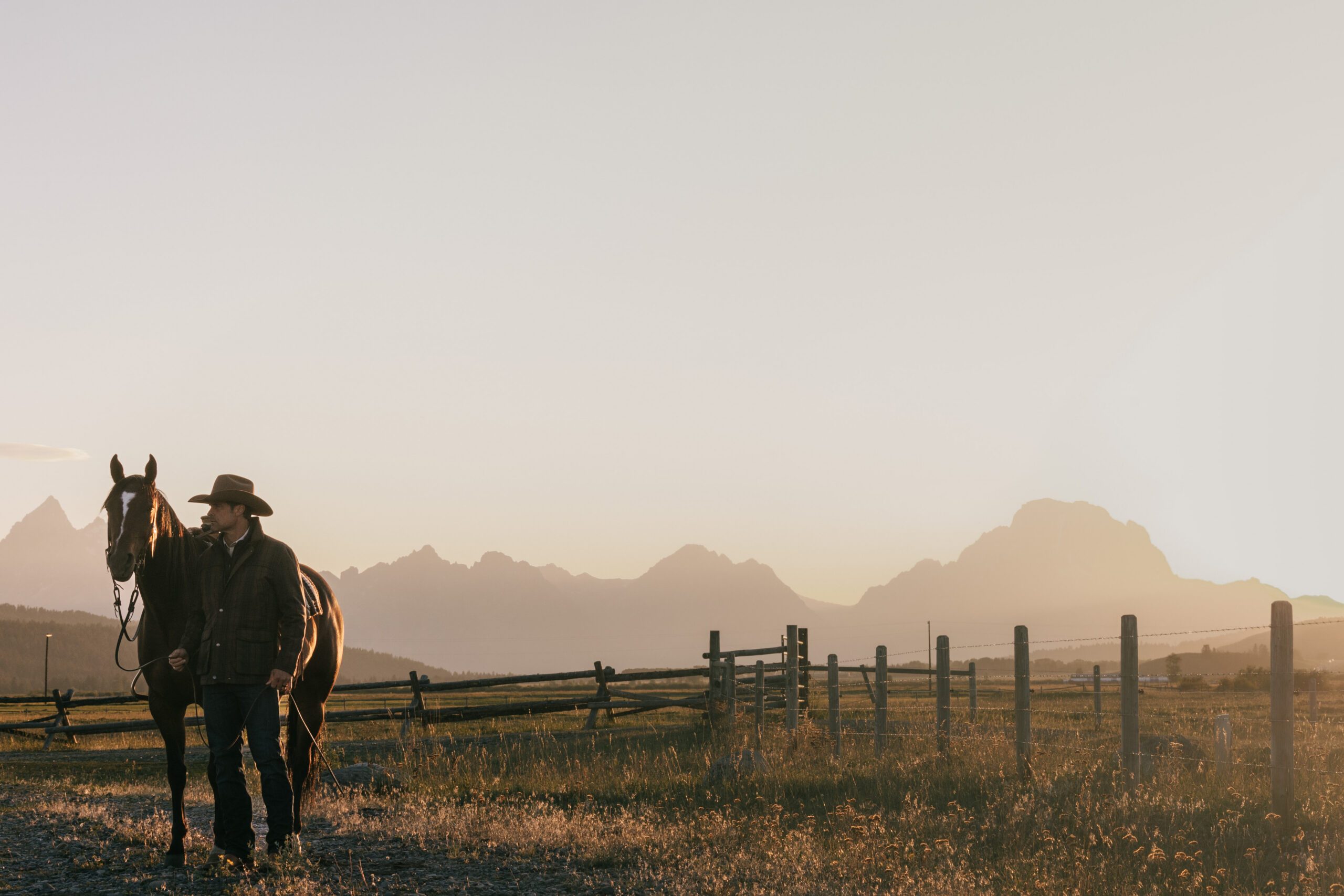 man and horse with mountains