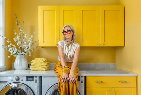 woman sitting by laundry machines